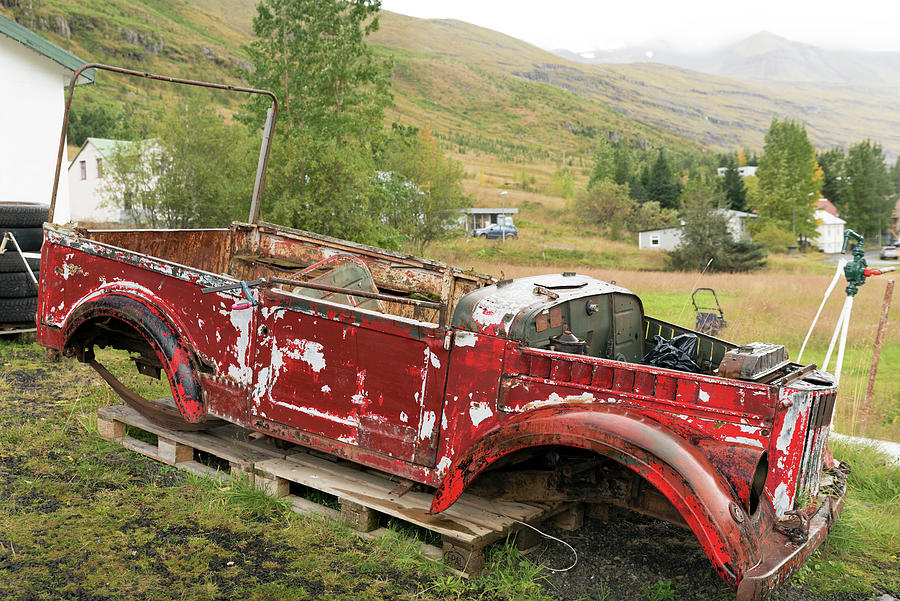 Remains of an old red car in Seydisfjordur #3 Photograph by RicardMN Photography
