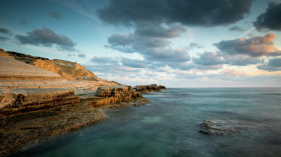 Rocky seashore seascape with dramatic and beautiful sunset. #1 Photograph by Michalakis Ppalis