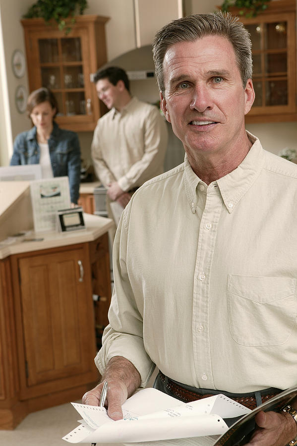 Salesman in home improvement store #3 Photograph by Comstock Images