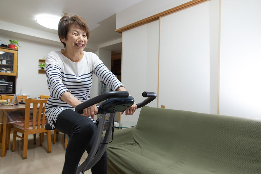 Senior woman training at home #3 Photograph by Kumikomini
