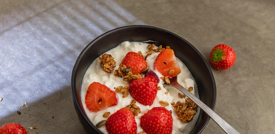 Sheep yoghurt topped with strawberries and granola. #3 Photograph by Annick Vanderschelden Photography