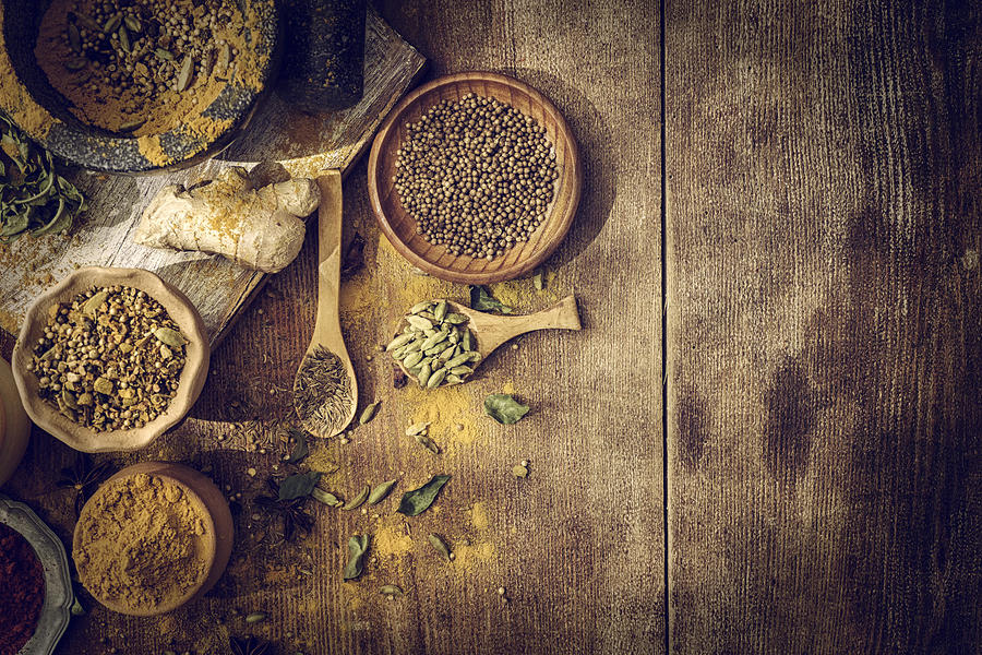 Spices and Herbs on Wooden Background #3 Photograph by GMVozd