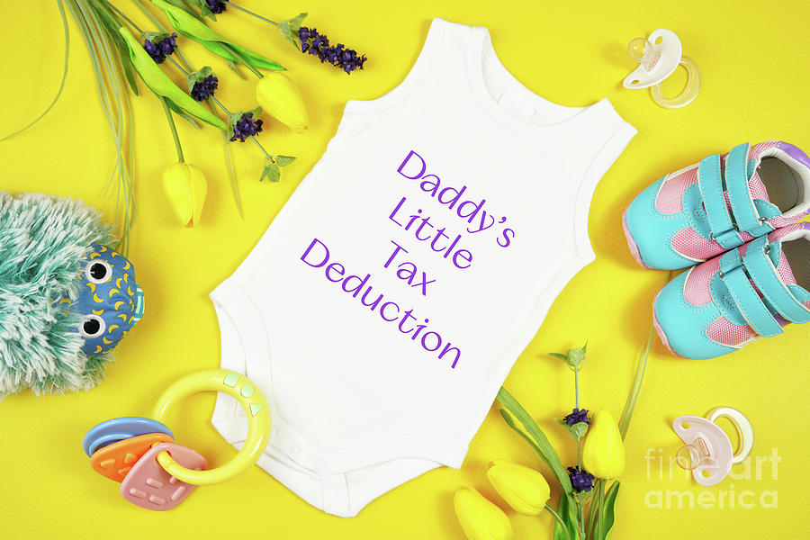 Springtime baby apparel flatlay top view on yellow table. Mock up. #3 Photograph by Milleflore Images