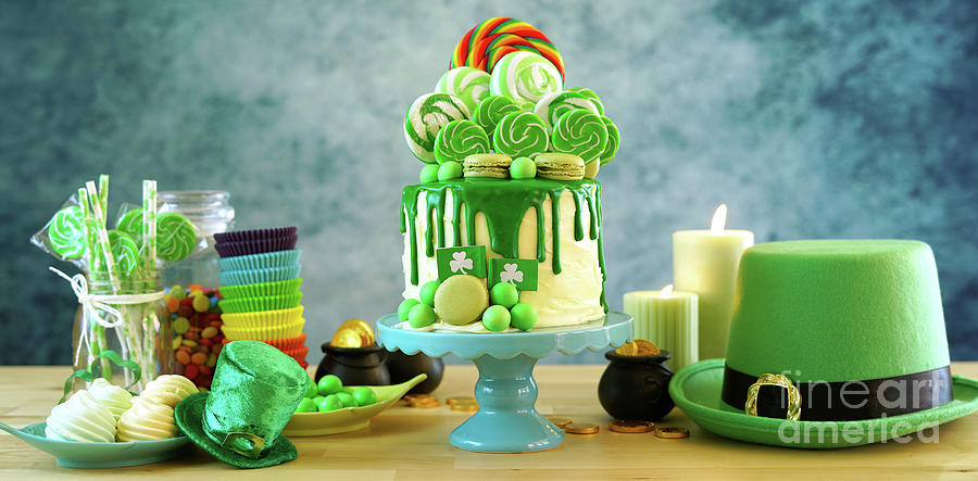 St Patricks Day candyland drip cake and party table. #3 Photograph by Milleflore Images