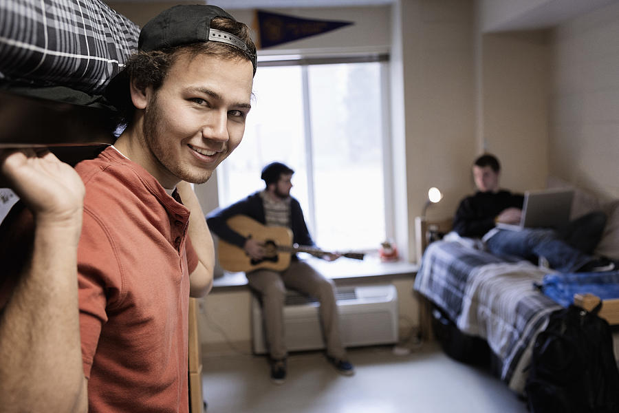 Students relaxing in dorm room #3 Photograph by Hill Street Studios