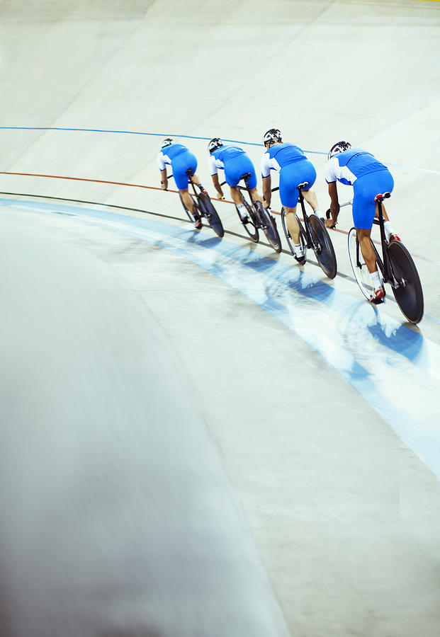 Track cycling team riding in velodrome #3 Photograph by Caia Image