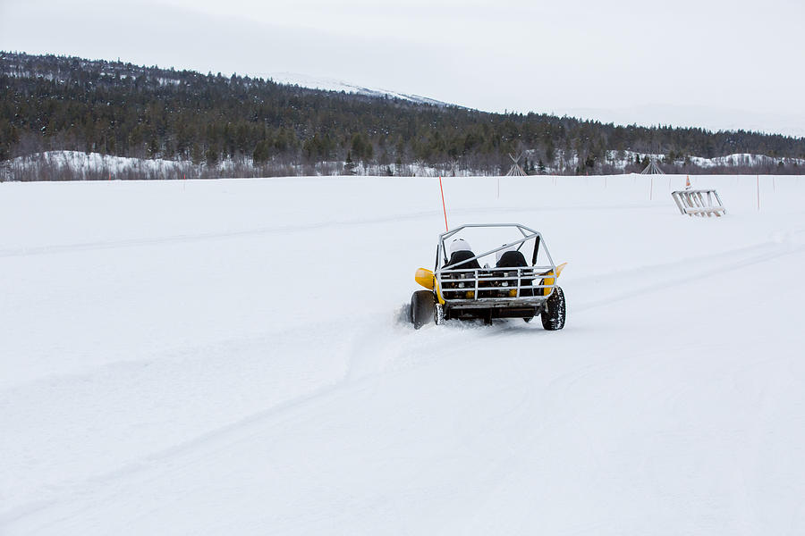 Two People Drive a Snow Buggy Around an Obstacle Course in Rural Norway, Wintertime #3 Photograph by Morten Falch Sortland