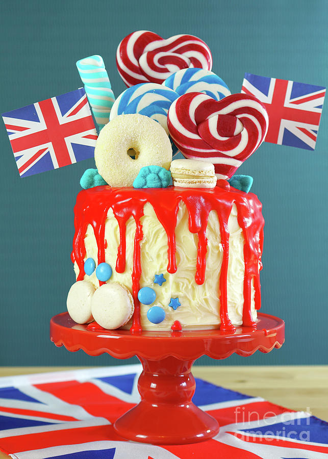 Cake Photograph - UK candyland drip cake with red white and blue decorations, lollipops and flags. #3 by Milleflore Images