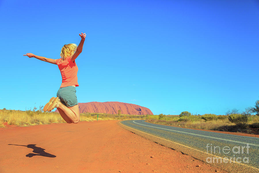 Uluru woman jumping #3 Photograph by Benny Marty