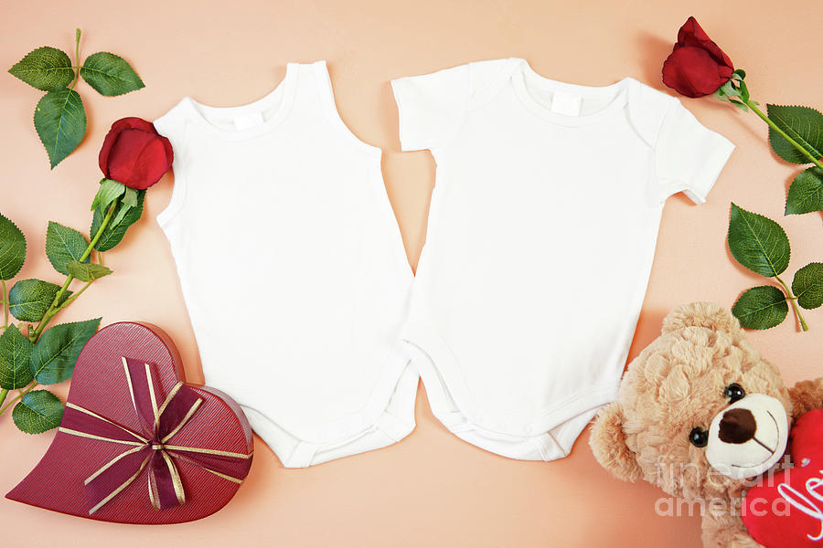 Valentine baby apparel flatlay top view on yellow table. Mock up. #3 Photograph by Milleflore Images