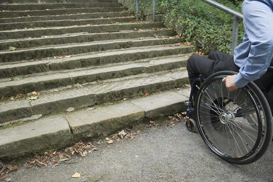 Wheelchair user in front of staircase Barrier (XXL) #3 Photograph by RelaxFoto.de