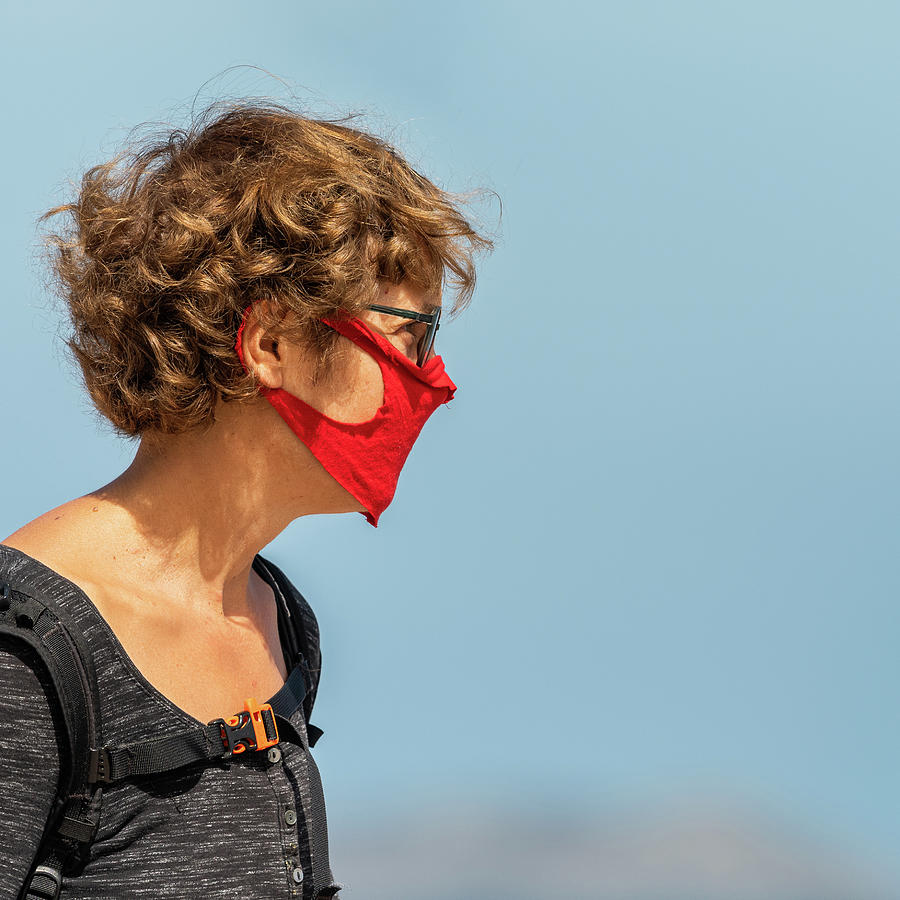 Woman Wearing A Mask On The Street Photograph