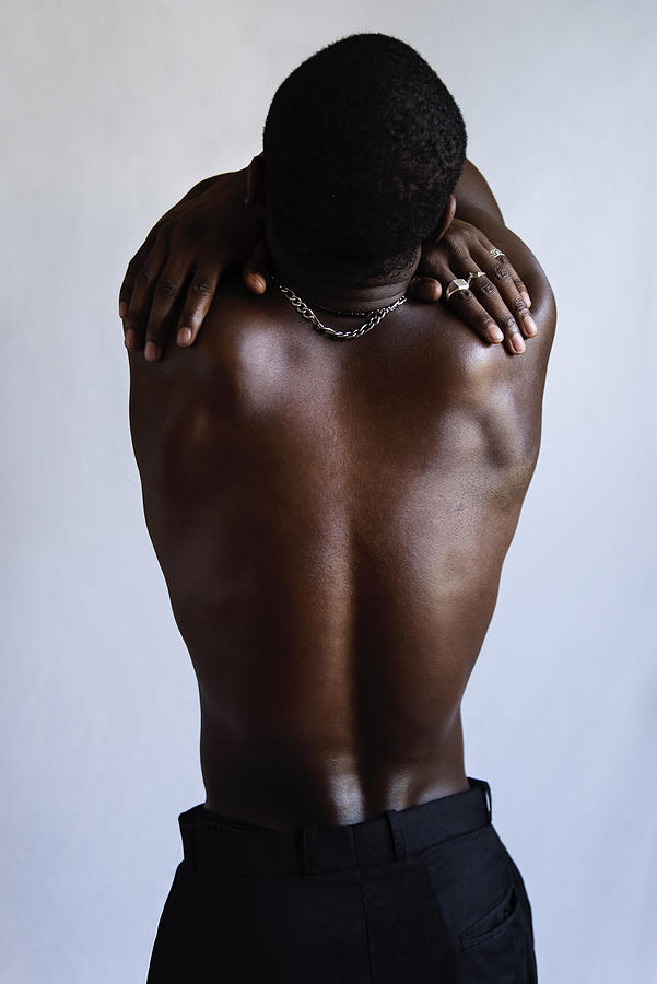 Young adult man with dark skin studio portrait. #3 Photograph by Martinedoucet