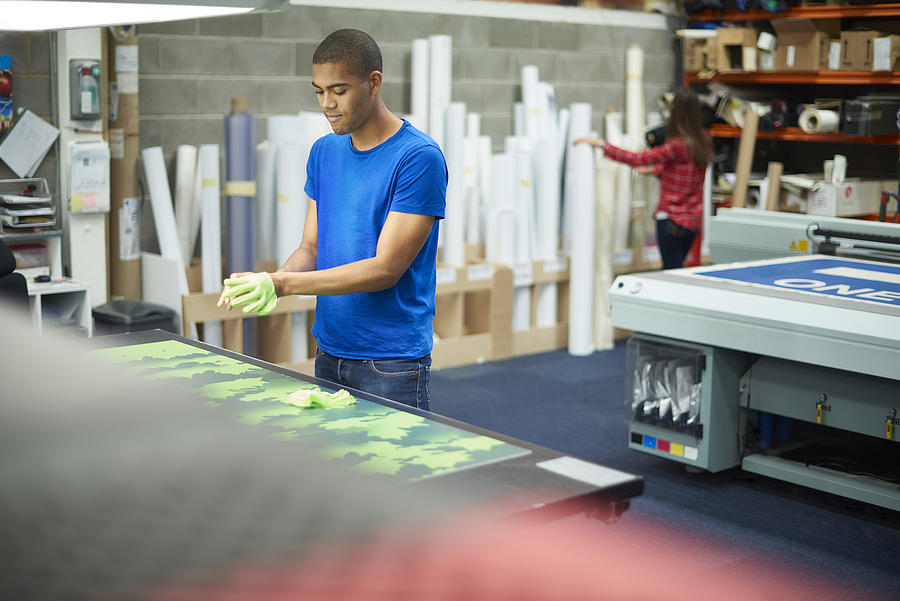 Young Man Working At A Signage Company #3 Photograph by Sturti