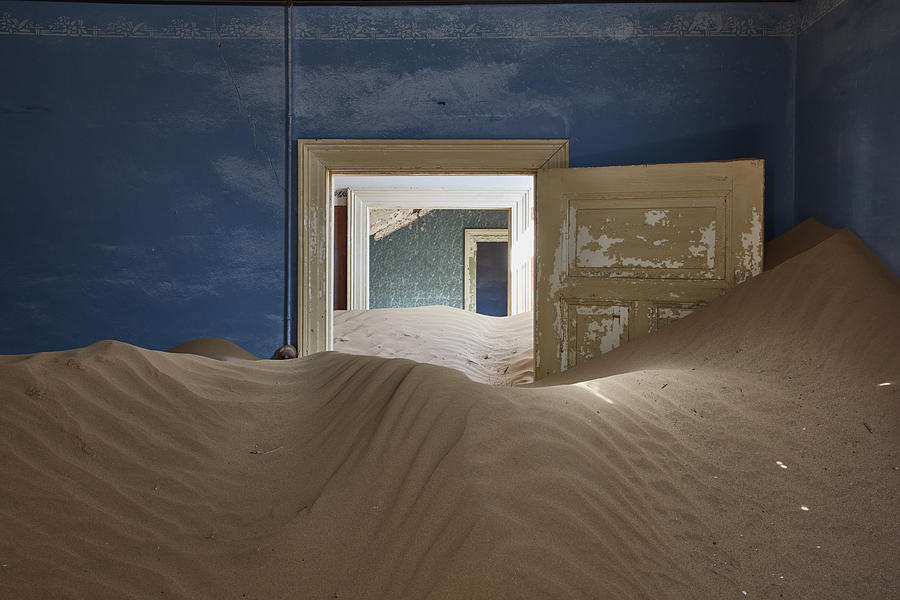 A view of a room in a derelict building full of sand. #4 Photograph by Mint Images
