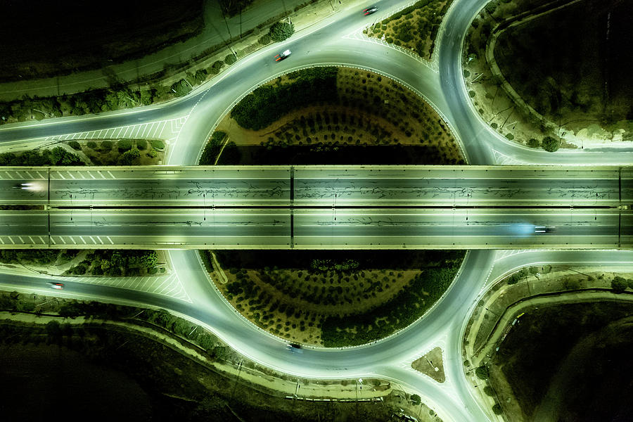 Aerial drone top view of a modern motorway junction roundabout with cars moving. Transportation infrastructure, #4 Photograph by Michalakis Ppalis