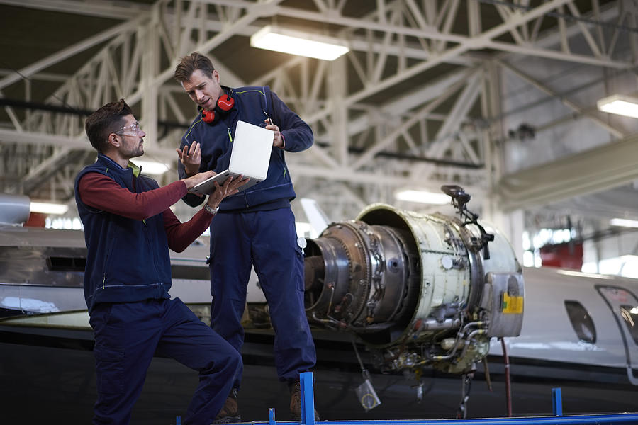 Aircraft mechanics in the hangar #4 Photograph by Extreme-photographer