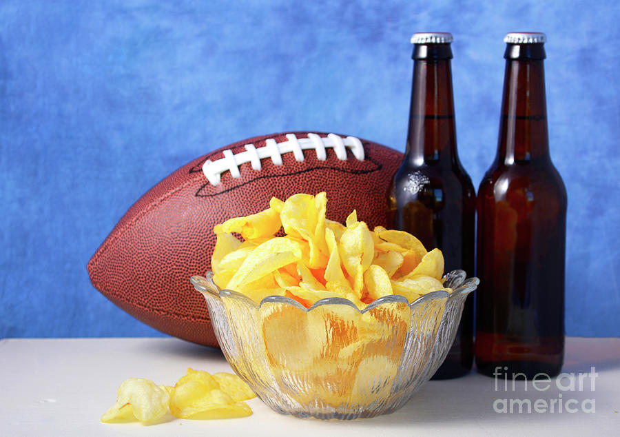 American football with beer and chips. #4 Photograph by Milleflore Images