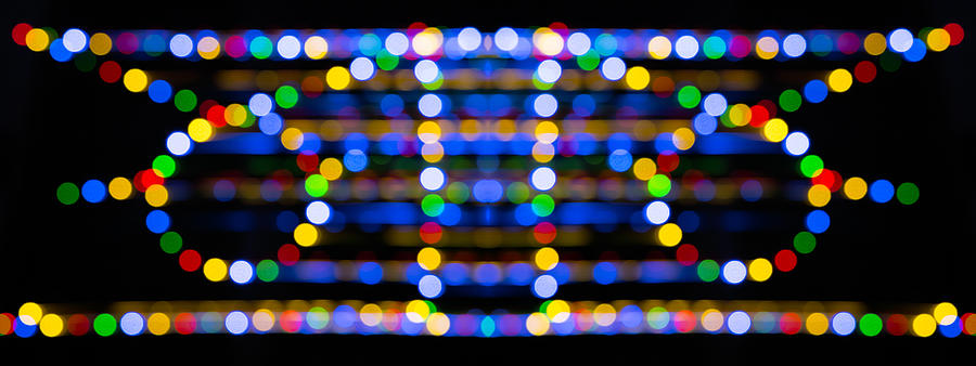 Close-up abstract pattern of intertwined colorful light beams of colors red, green and blue on a  black background. #4 Photograph by Jose A. Bernat Bacete
