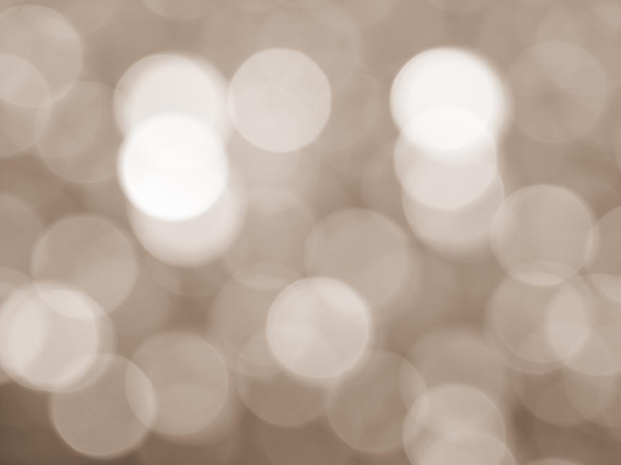 Close-up unfocused lights in the shape of circles of vintage brown background #4 Photograph by Jose A. Bernat Bacete