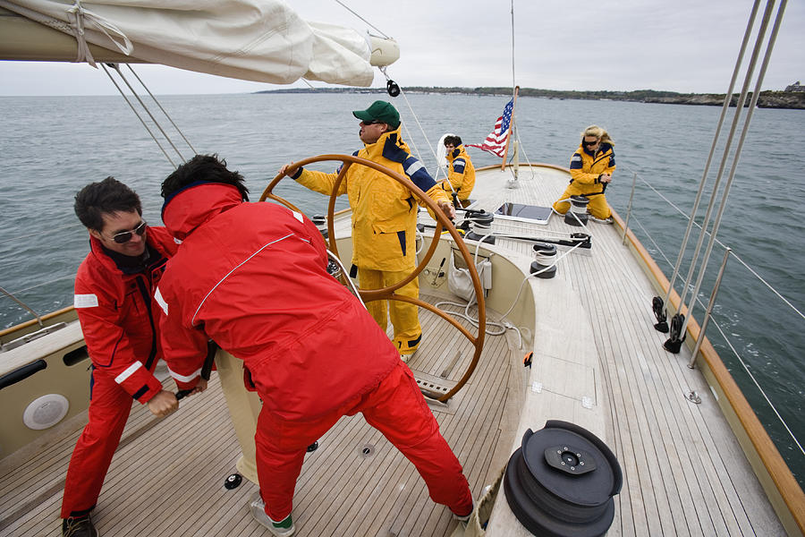 Crew sailing racing yacht #4 Photograph by Jeff Randall