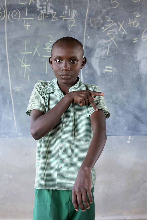 Deaf children learning sign language at school. #4 Photograph by Hugh Sitton