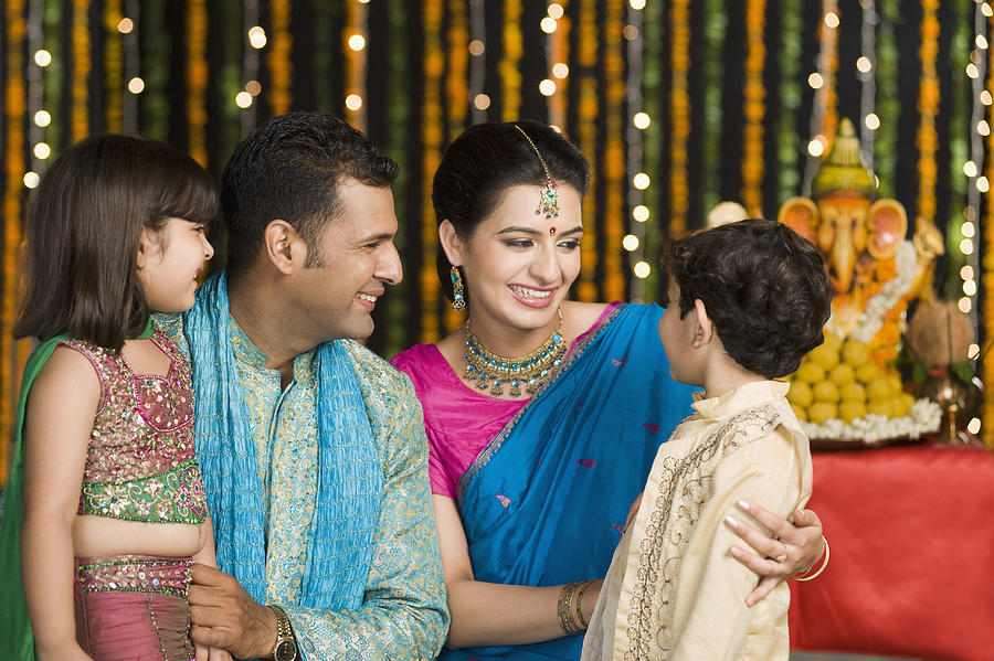 Family celebrating Diwali #4 Photograph by Photosindia