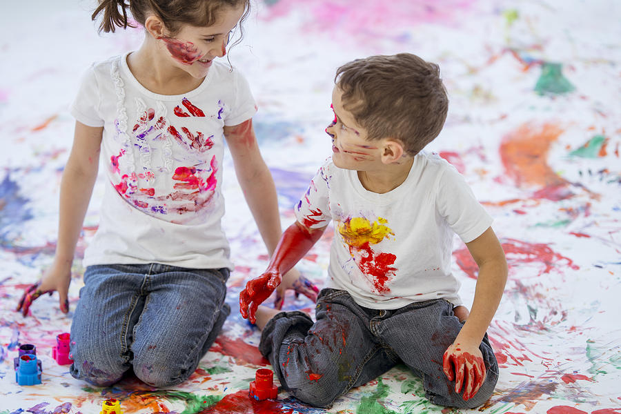 Fun Childhood Finger Painting Brother and Sister #4 Photograph by FatCamera