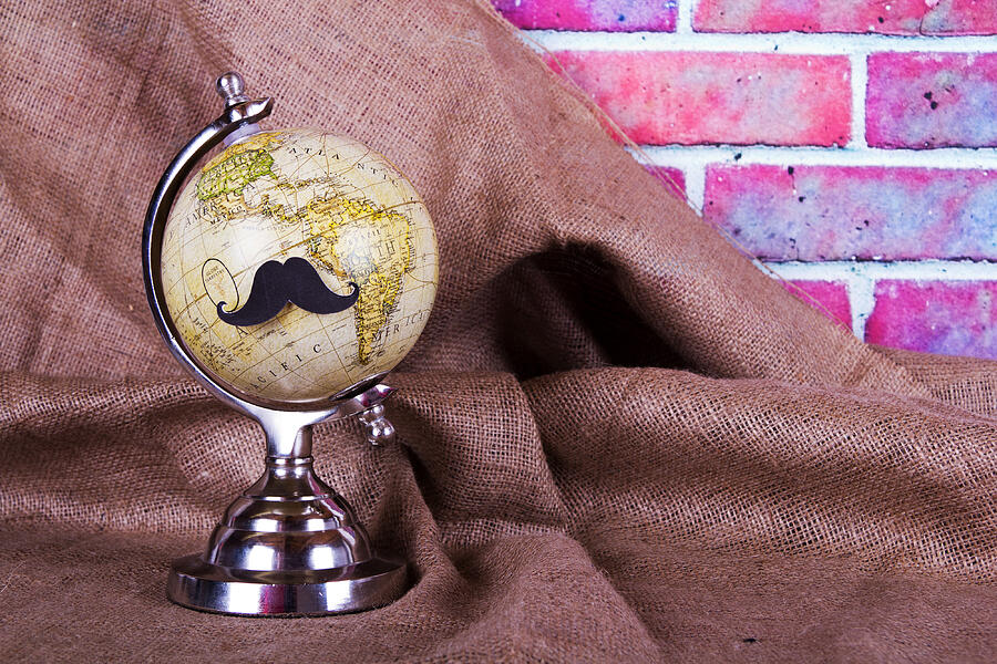 Globe with a black hipster mustache #4 Photograph by Christopherhall