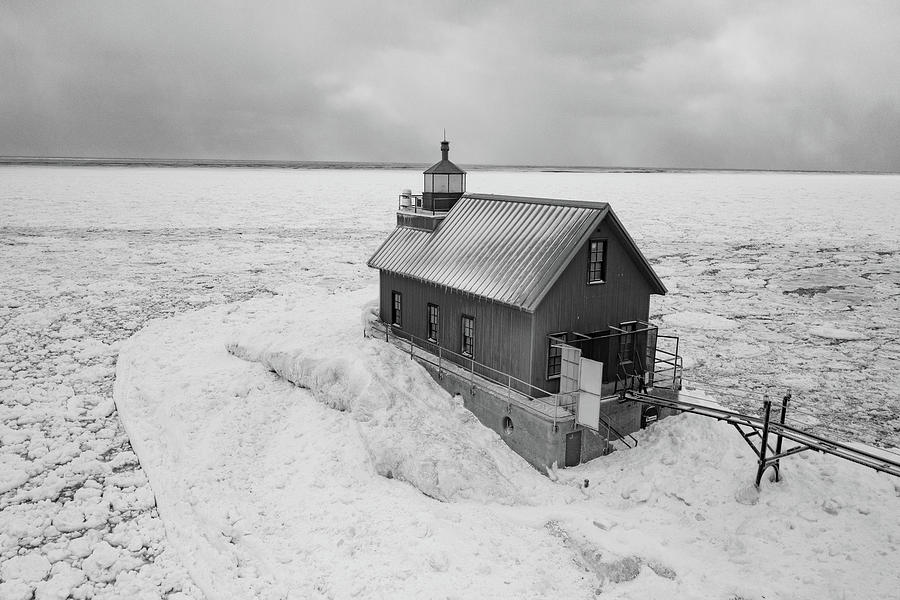 Grand Haven Michigan lighthouse in the winter in black and white #4 Photograph by Eldon McGraw