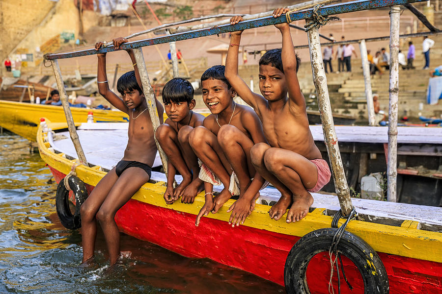 Little boys having fun in  Ganges River, Varanasi #4 Photograph by Hadynyah