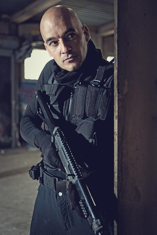Male military swat team member holding gun in abandoned warehouse #4 Photograph by Lorado