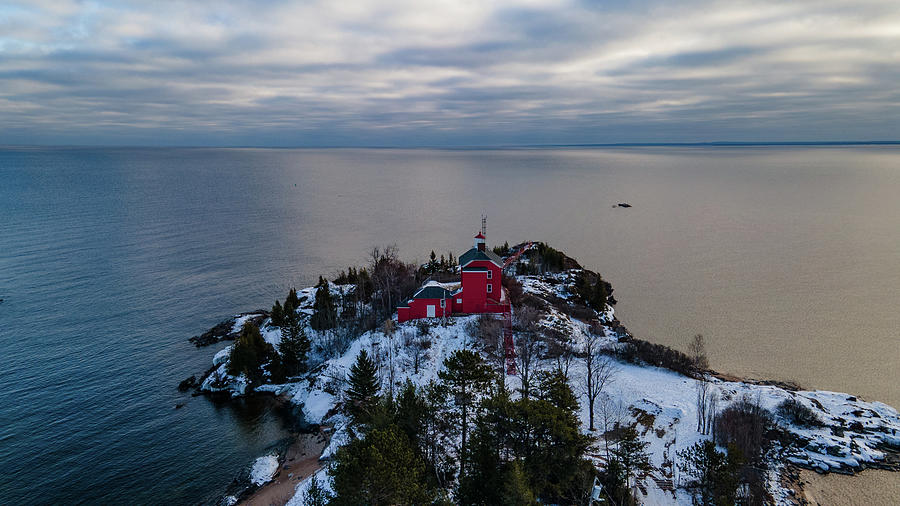 Marquette Harbor Lighthouse along Lake Superior in Marquette Michigan in the winter #4 Photograph by Eldon McGraw