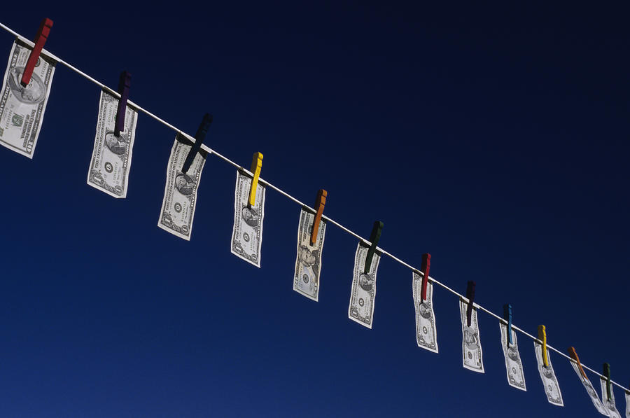 Money hanging from washing line, low angle view #4 Photograph by Jim Corwin