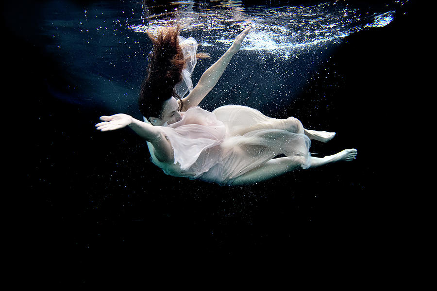 Nina floating in pool with dress Photograph by Dan Friend - Fine Art ...