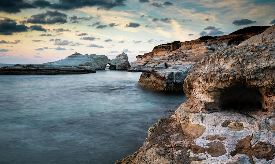 Rocky seashore seascape with dramatic and beautiful sunset. Photograph by Michalakis Ppalis