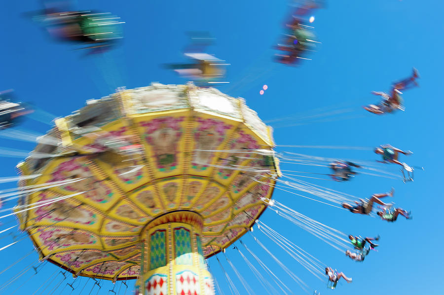 Spinning Carousel With People Photograph By David May - Pixels