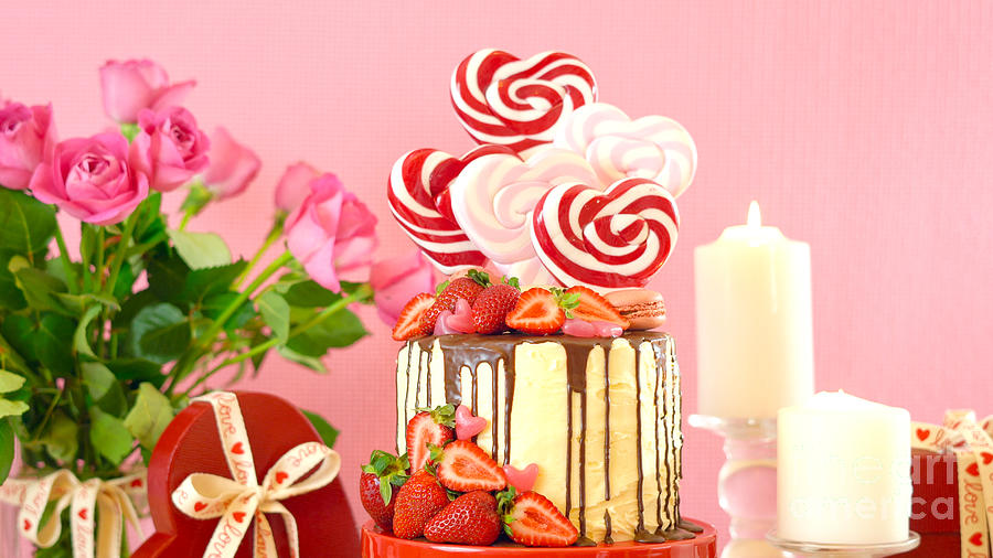 Valentines Day candyland drip cake decorated with heart shaped lollipops. #4 Photograph by Milleflore Images