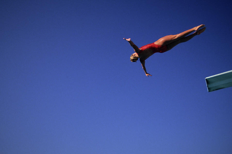 Woman diver flying through the air. Photograph by PCN Photography | Pixels