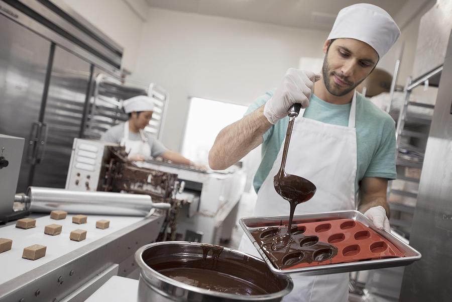 Worker in manufacture of chocolates #4 Photograph by Hiya Images/Corbis/VCG