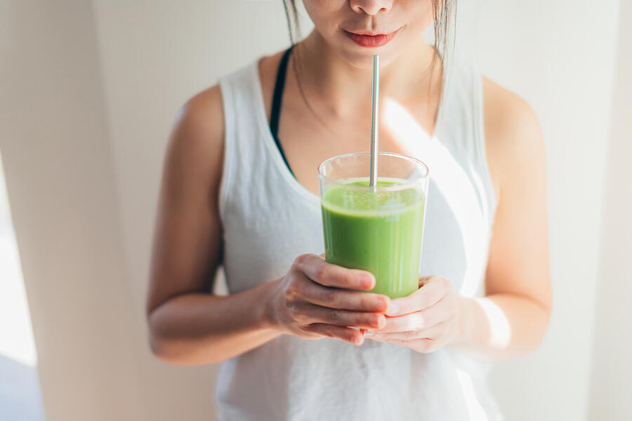 Young Woman Drinking Green Juice For Cleanse Diet #4 Photograph by Oscar Wong