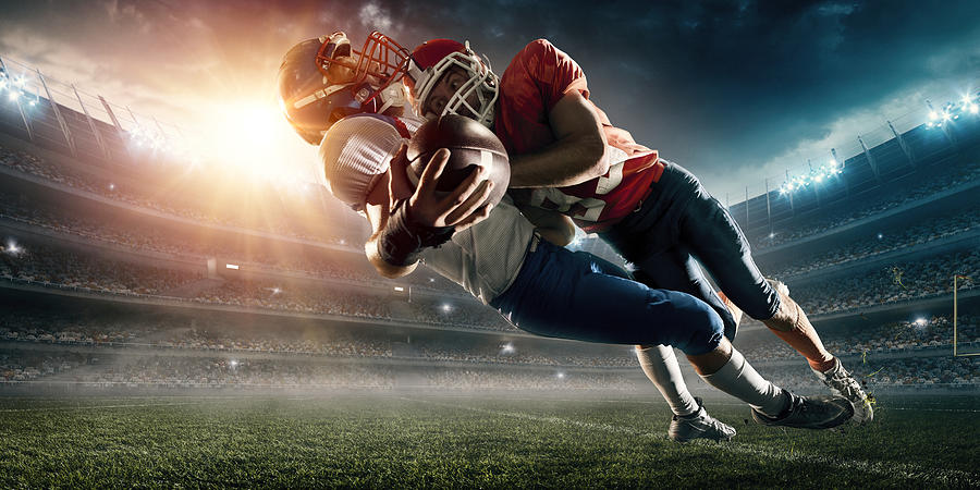 American football player being tackled #5 Photograph by Dmytro Aksonov