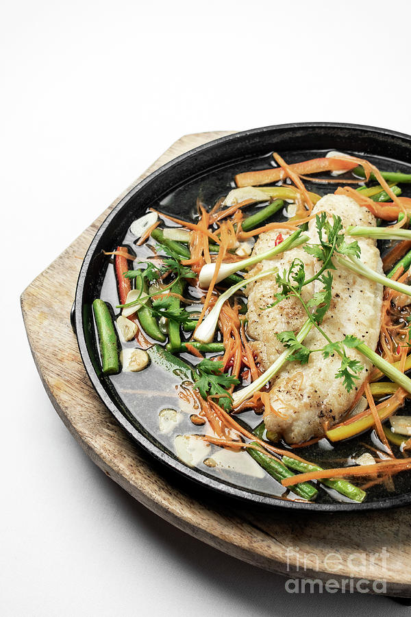 Chinese Style Steamed Fish Fillet With Vegetables On Hot Plate