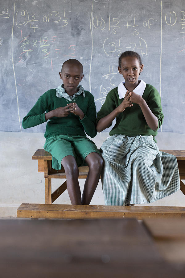 Deaf children learning sign language at school. #5 Photograph by Hugh Sitton