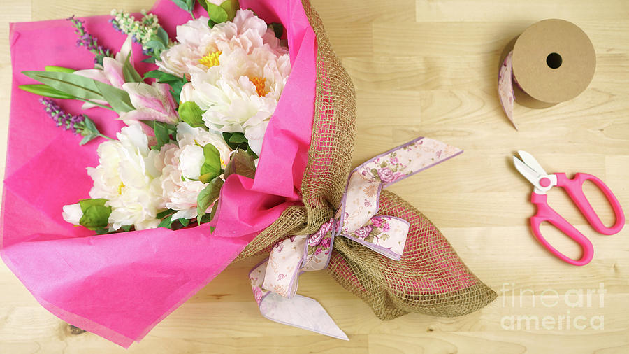 Flowers wrapped in pink tissue and hessian modern trend wrapping flatlay. #5 Photograph by Milleflore Images