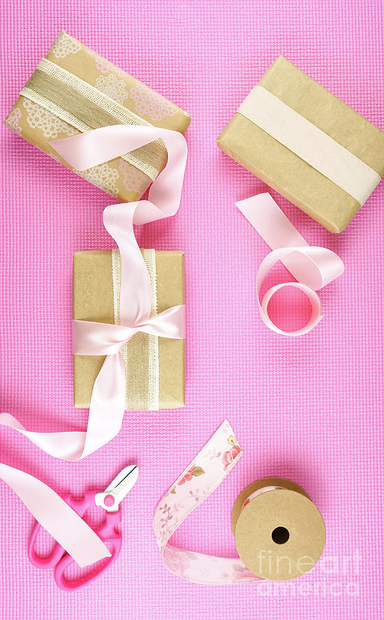 Gifts wrapped in kraft paper and pink ribbons overhead flatlay. #5 Photograph by Milleflore Images