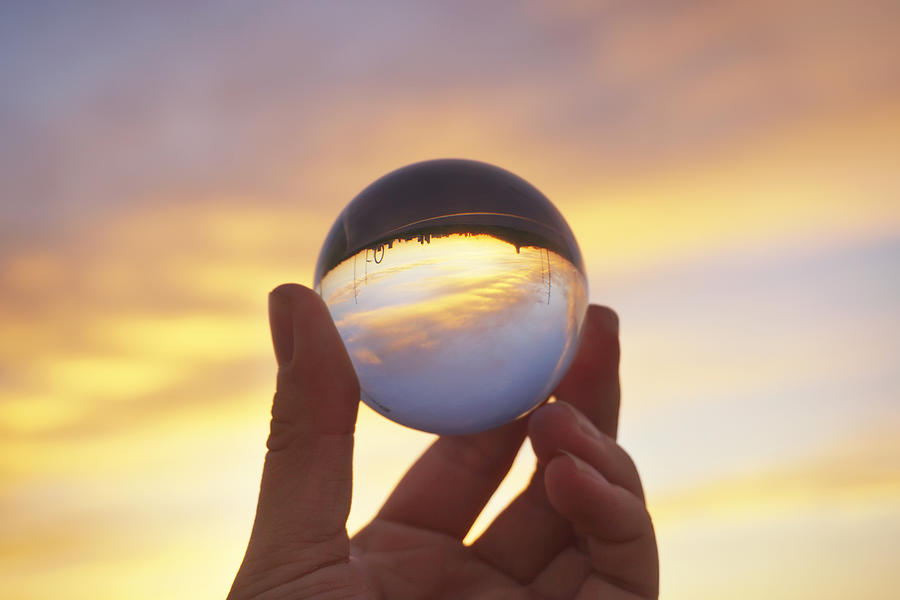 Man holding crystal ball #5 Photograph by Zhuyongming