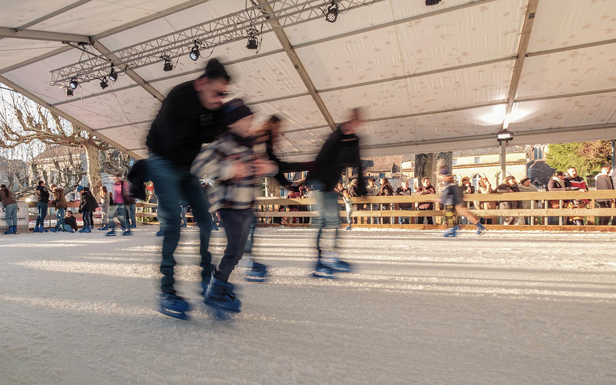 Skaters on the ice at Sarlat Christmas market #5 Photograph by Jon ...