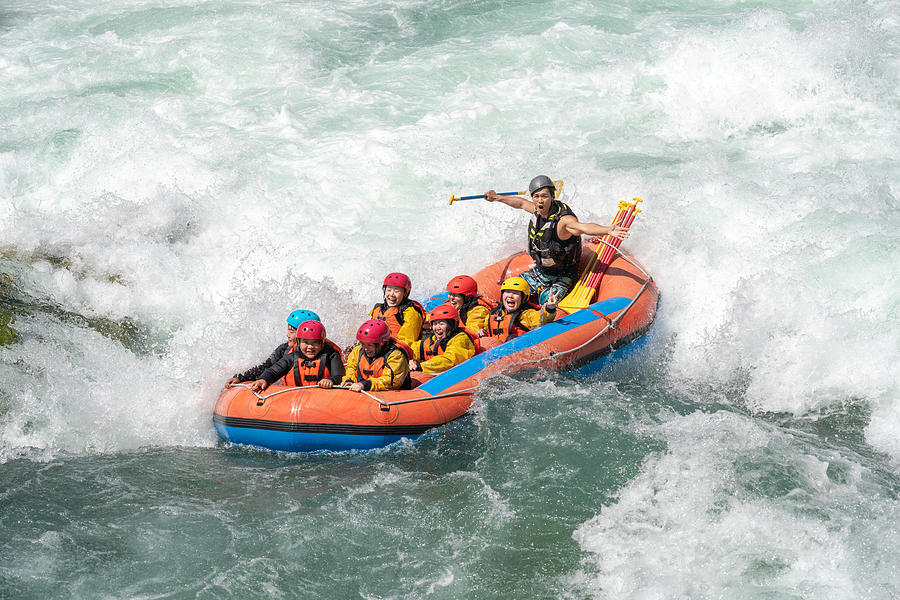 Small group of men and women white water river rafting #5 Photograph by Tdub303