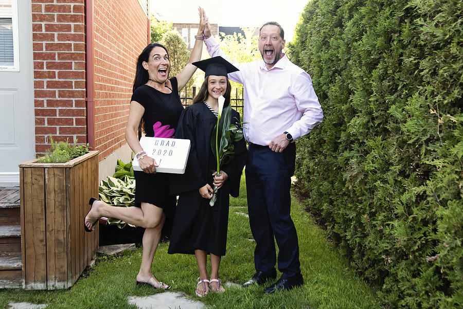 Teenage girl graduation from primary school family portrait in backyard. #5 Photograph by Martinedoucet
